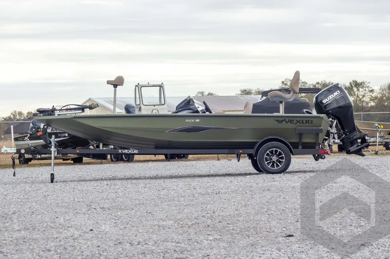Slide: The Image of 2026 Vexus Defender 181 boat on trailer, side view, outdoors. - 8