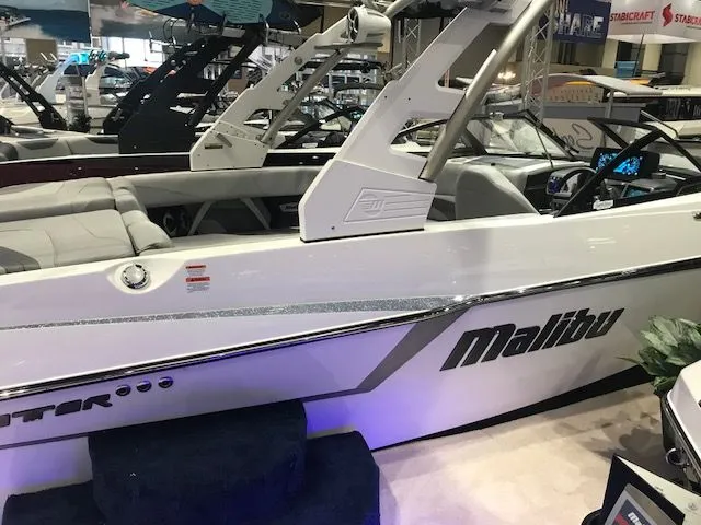 Slide: The Image of 2018 Malibu Wakesetter 22 MXZ boat, white, sleek design. - 11
