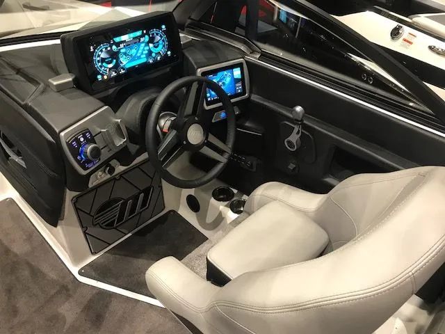 Slide: The Image of Interior of 2018 Malibu Wakesetter 22 MXZ with modern seating and controls. - 7