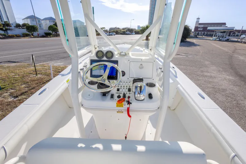 Slide: The Image of 2008 Everglades 243 Center Console boat interior with steering wheel and controls. - 10