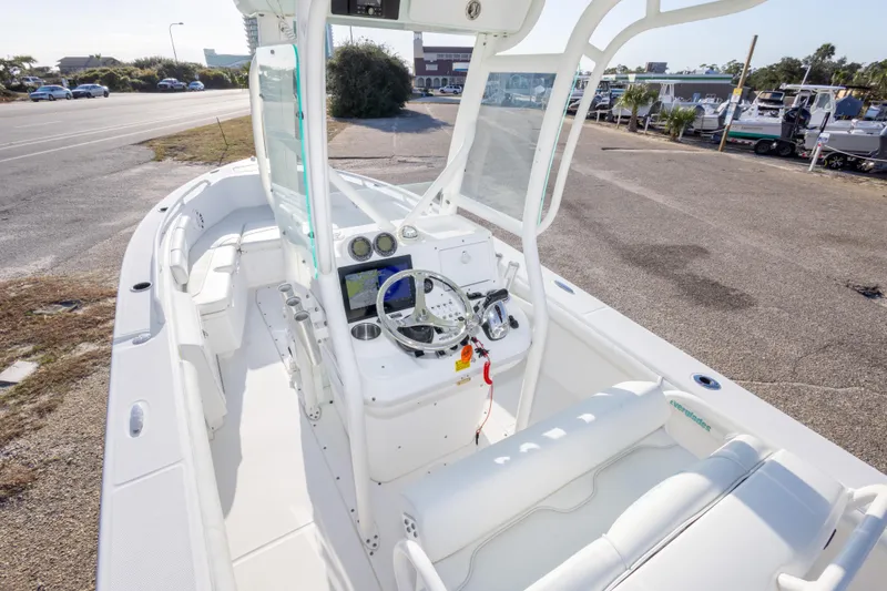 Slide: The Image of 2008 Everglades 243 Center Console boat interior with steering wheel and seating. - 13