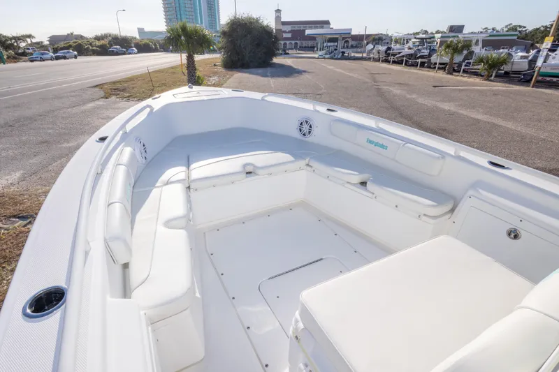 Slide: The Image of 2008 Everglades 243 Center Console boat with spacious seating, parked near a marina. - 16