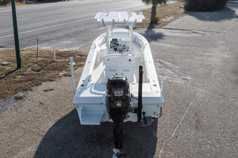Slide: The Image of 2008 Everglades 243 Center Console boat with Suzuki 300 outboard motor, parked on pavement. - 26