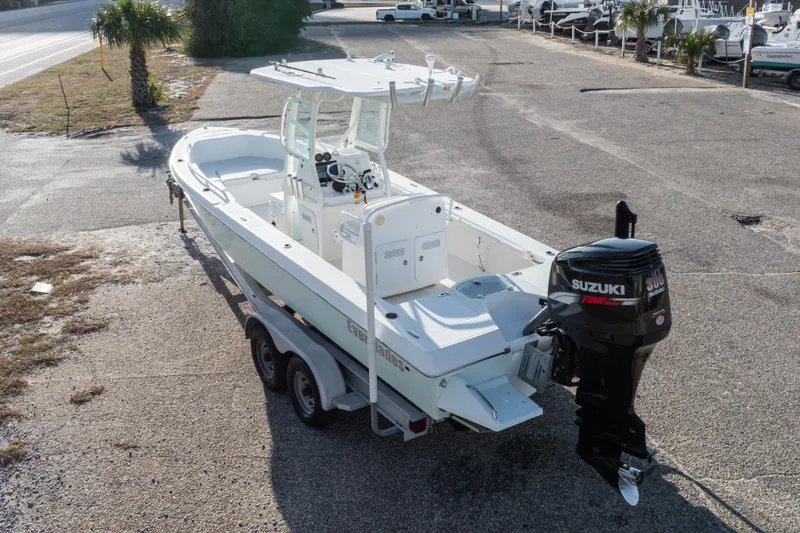 Slide: The Image of 2008 Everglades 243 Center Console boat with Suzuki outboard motor on trailer. - 27