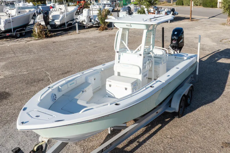 Slide: The Image of 2008 Everglades 243 Center Console boat on trailer, parked in marina lot. - 30