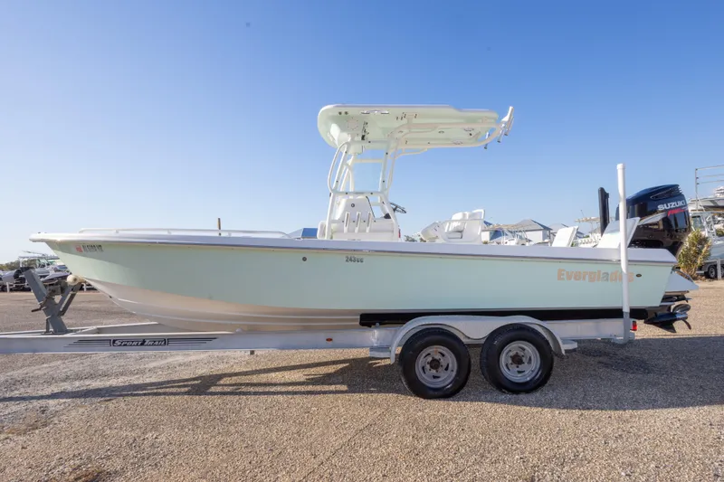 Slide: The Image of 2008 Everglades 243 Center Console boat on trailer, side view, clear sky background. - 4