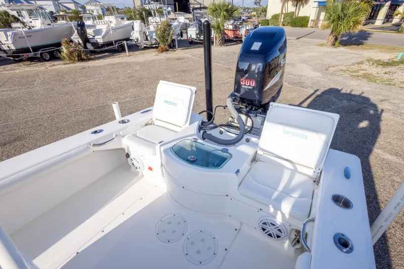 Slide: The Image of 2008 Everglades 243 Center Console boat with powerful 300 HP engine, docked outdoors. - 8