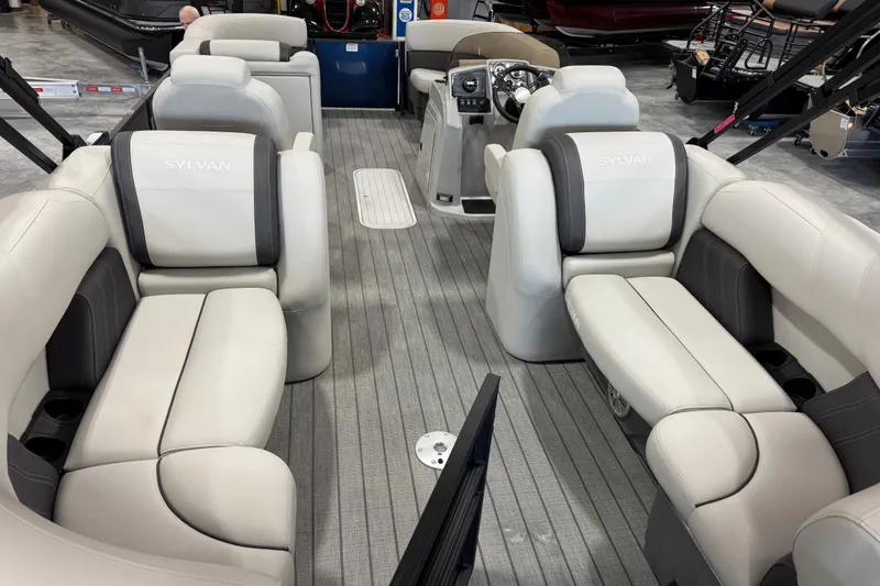 Slide: The Image of Luxurious interior of 2023 Sylvan X-3 boat with plush seating and modern dashboard. - 11