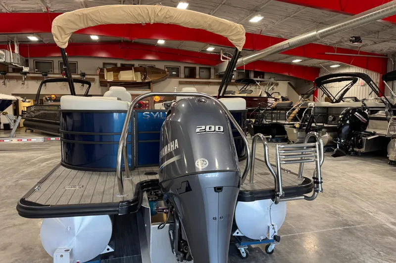 Slide: The Image of 2023 Sylvan X-3 boat with Yamaha 200 engine in showroom. - 6