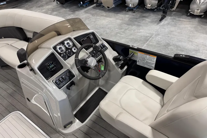 Slide: The Image of 2023 Sylvan X-3 boat interior with modern dashboard and comfortable seating. - 8