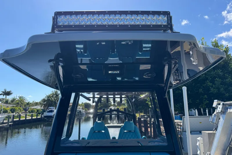 Slide: The Image of 2026 Costa Custom Boats 264 HC with sleek design and advanced lighting on a sunny day. - 12