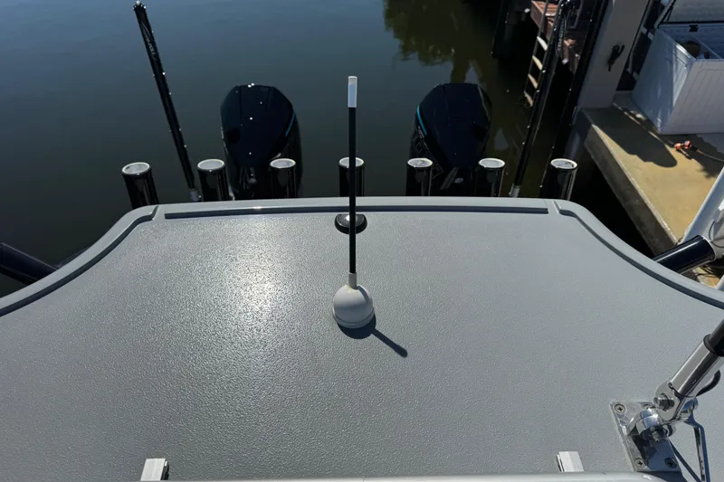 Slide: The Image of 2026 Costa Custom Boats 264 HC deck with fishing rod holders and outboard motors. - 15