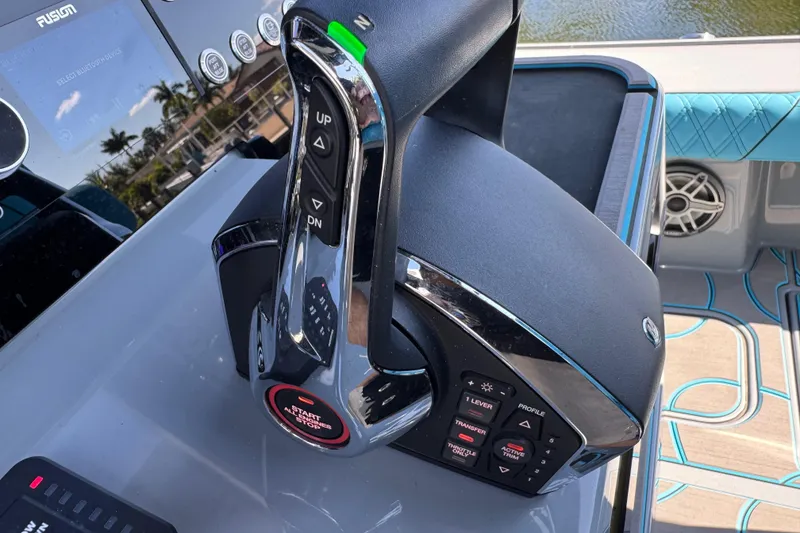 Slide: The Image of Control panel of 2026 Costa Custom Boats 264 HC, featuring advanced throttle and navigation controls. - 29