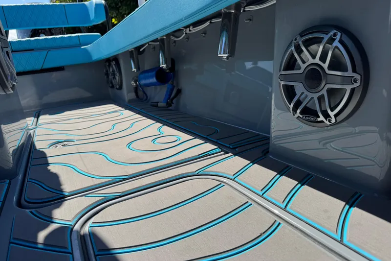 Slide: The Image of 2026 Costa Custom Boats 264 HC interior with stylish flooring and premium audio system. - 35