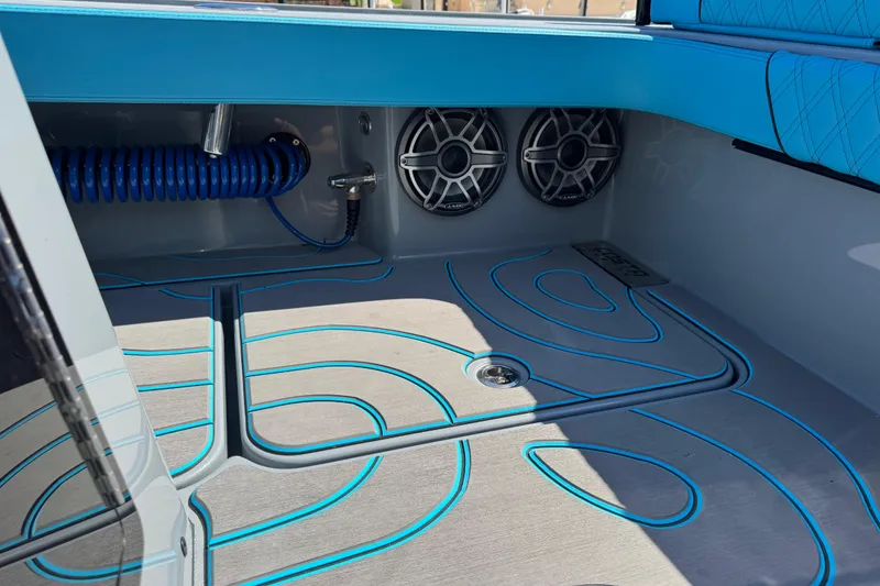 Slide: The Image of Interior of 2026 Costa Custom Boats 264 HC with stylish flooring and speakers. - 38