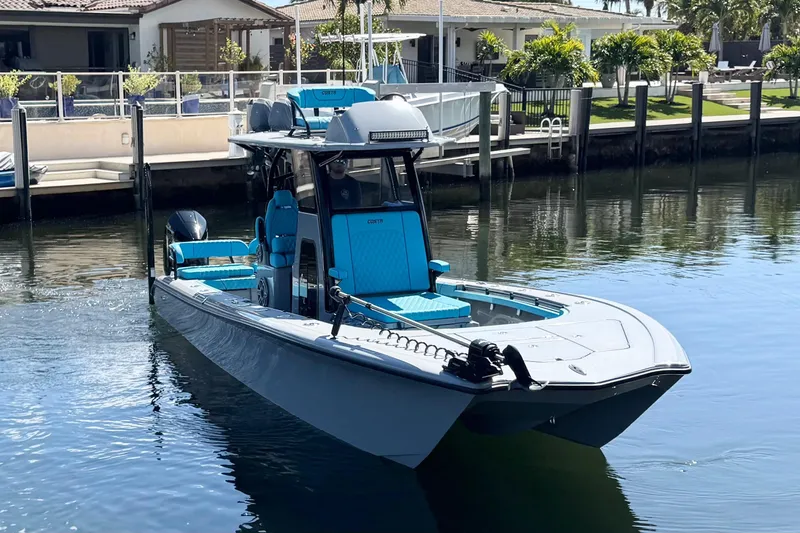 Slide: The Image of 2026 Costa Custom Boats 264 HC in a serene waterfront setting. - 4