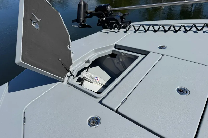 Slide: The Image of 2026 Costa Custom Boats 264 HC deck with open storage compartment. - 42