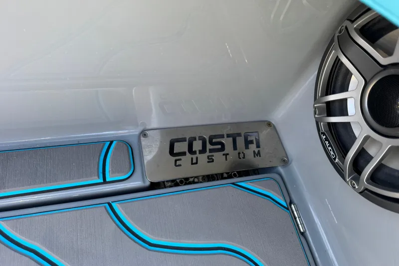 Slide: The Image of Interior of 2026 Costa Custom Boats 264 HC with speaker and branded panel. - 47