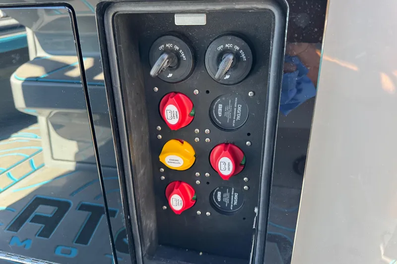 Slide: The Image of Control panel of 2026 Costa Custom Boats 264 HC with switches and key ignition. - 51