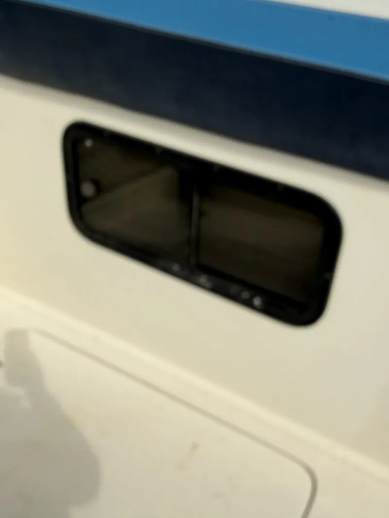 Slide: The Image of Window of a 1988 Silverton 34X boat, close-up view. - 10