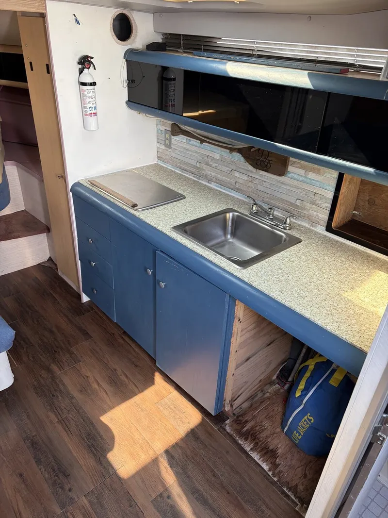 Slide: The Image of Interior of 1988 Silverton 34X with kitchenette and sink. - 12