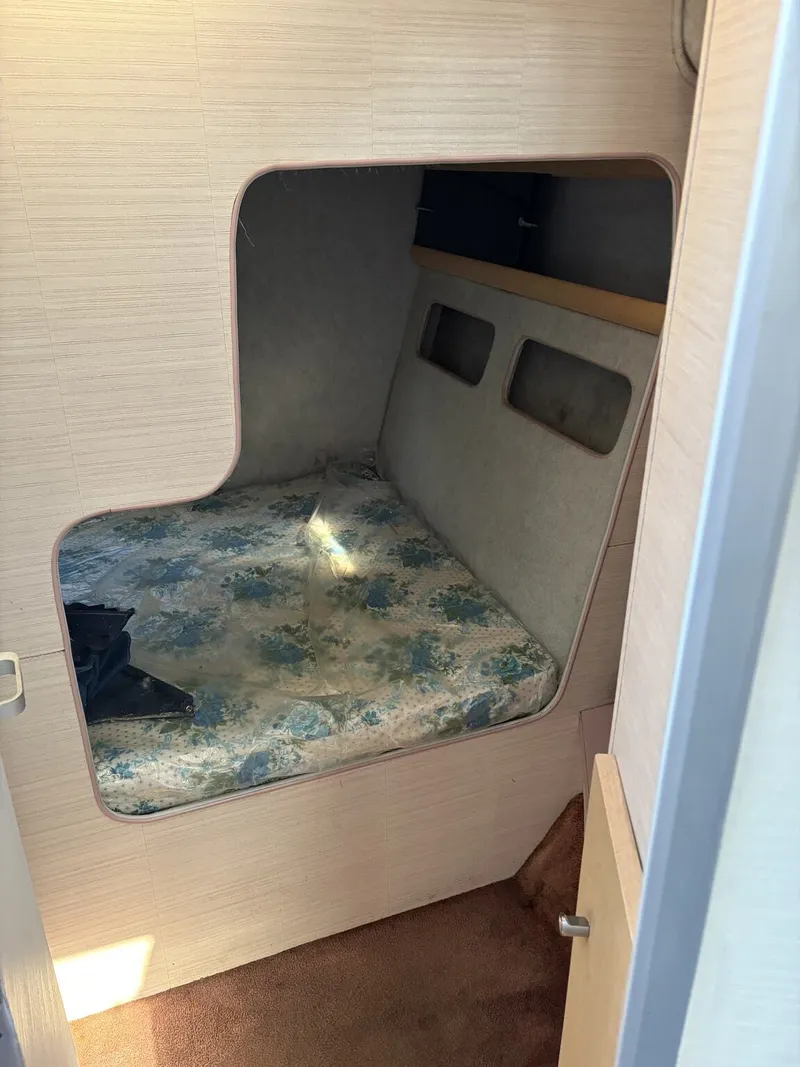 Slide: The Image of Interior of a 1988 Silverton 34X yacht with sleeping area. - 13