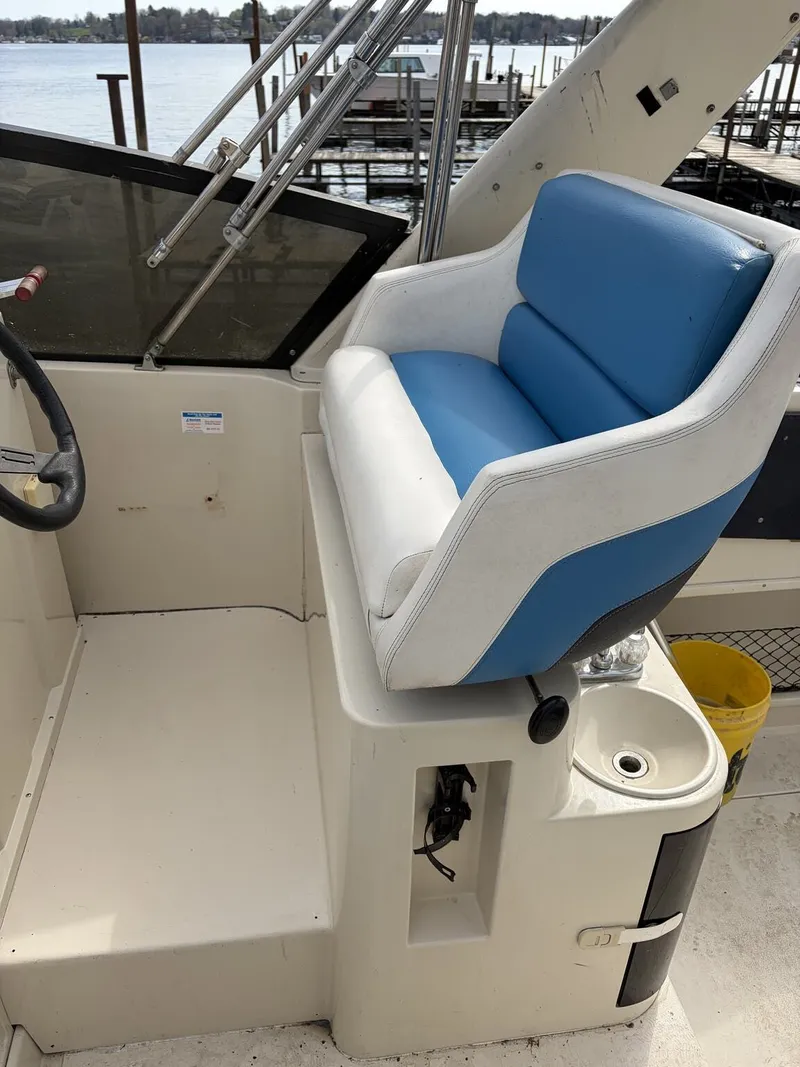 Slide: The Image of Helm of a 1988 Silverton 34X boat with blue seat. - 3