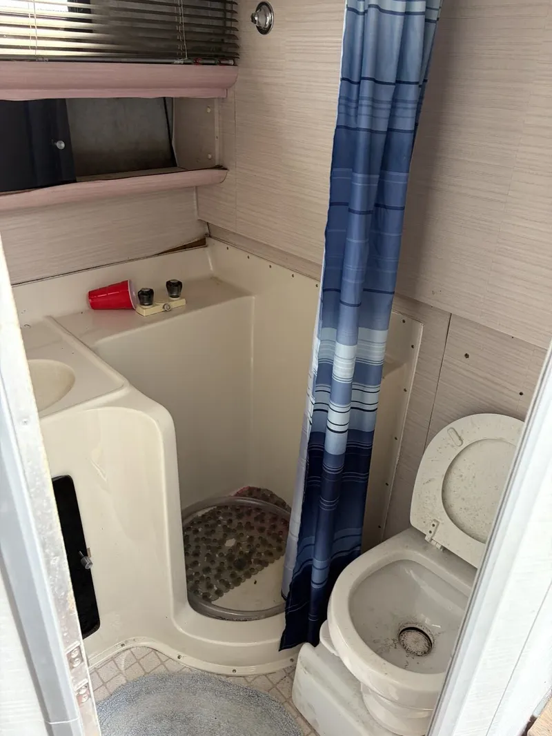 Slide: The Image of Bathroom in 1988 Silverton 34X boat with shower and toilet. - 5