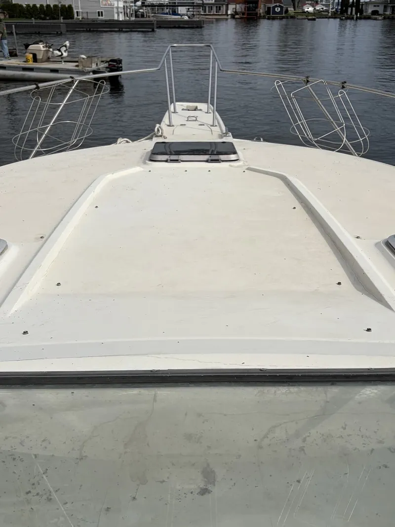 Slide: The Image of Bow view of a 1988 Silverton 34X yacht in harbor. - 8