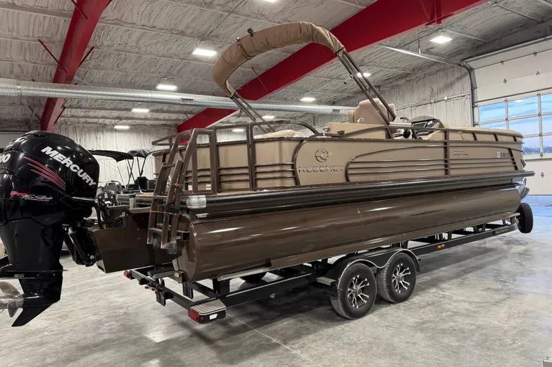 Slide: The Image of 2015 Sun Tracker Regency 254 XP3 pontoon boat in a showroom with Mercury engine. - 3