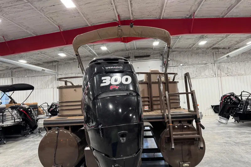 Slide: The Image of 2015 Sun Tracker Regency 254 XP3 pontoon boat with 300 HP Verado engine in showroom. - 6