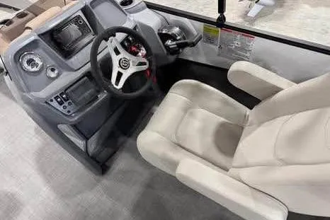 Slide: The Image of 2025 Sylvan A-22 boat interior with steering wheel and control panel. - 10