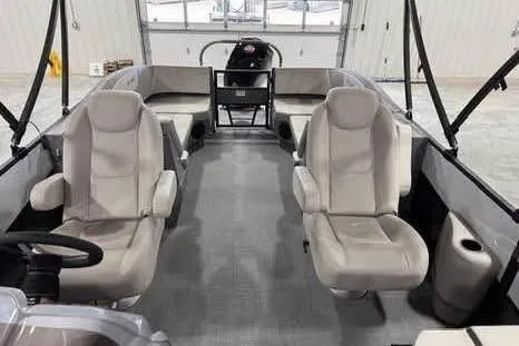 Slide: The Image of 2025 Sylvan A-22 boat interior with modern seating and spacious layout. - 11