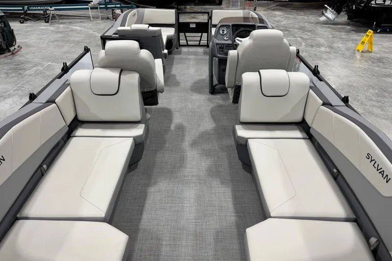 Slide: The Image of 2025 Sylvan A-22 boat interior with luxurious seating and modern design. - 12