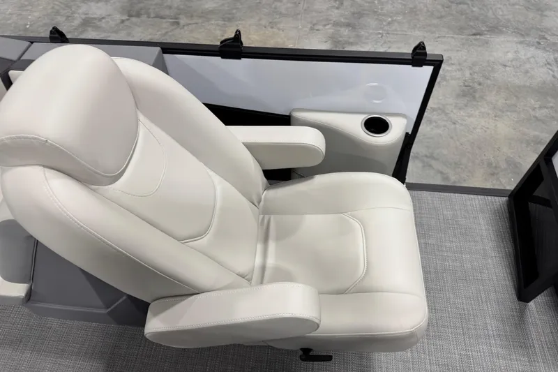 Slide: The Image of Luxurious white seat in 2025 Sylvan A-22 boat, featuring armrest and cup holder. - 9