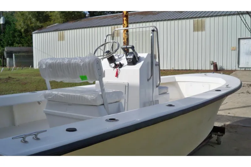 Slide: The Image of Manufacturer Provided Image: 2026 C-Hawk 23 Center Console boat with sleek design, parked outdoors. - 9