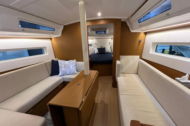 Slide: The Image of Interior of 2023 Jeanneau Sun Odyssey 380 yacht, featuring elegant seating and modern design. - 12