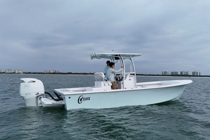 The Image of 2026 C-Hawk 25 Center Console boat on open water, featuring Suzuki outboard engine. - 1