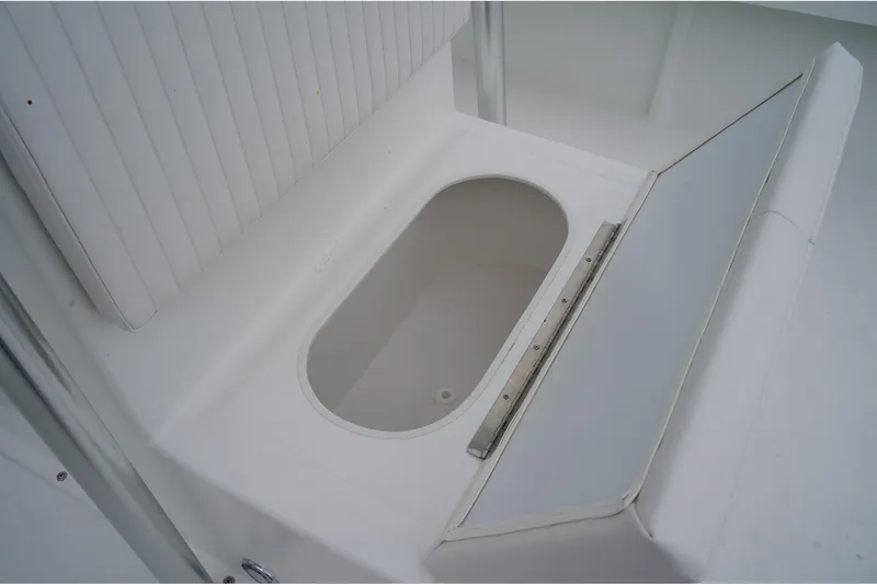 Slide: The Image of 2026 C-Hawk 25 Center Console boat with open storage compartment. - 14