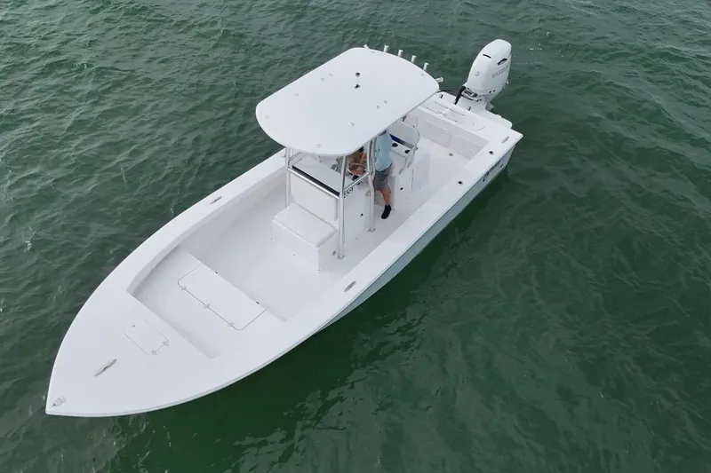 Slide: The Image of 2026 C-Hawk 25 Center Console boat on open water, aerial view. - 4