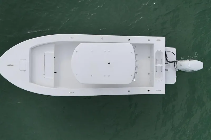 Slide: The Image of Aerial view of 2026 C-Hawk 25 Center Console boat on water. - 5