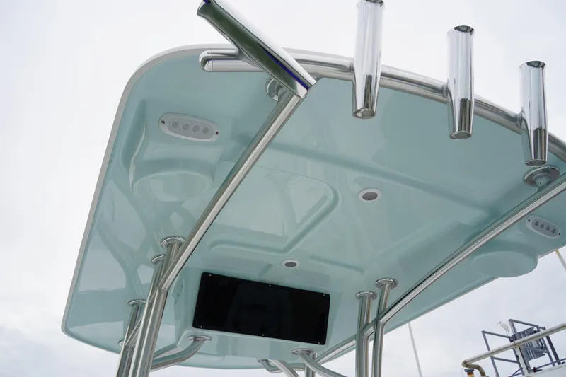 Slide: The Image of 2026 C-Hawk 25 Center Console boat with sleek T-top and rod holders. - 9