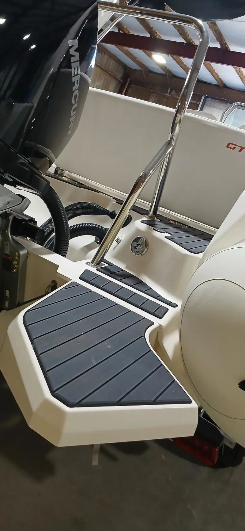 Slide: The Image of 2025 Zodiac Medline 7.5 GT boat with Mercury engine, featuring sleek design and modern fittings. - 5