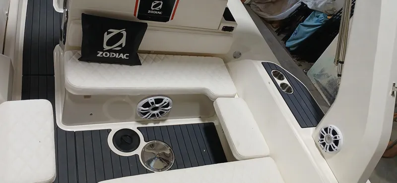 Slide: The Image of 2025 Zodiac Medline 7.5 GT boat interior with cushioned seating and speakers. - 6