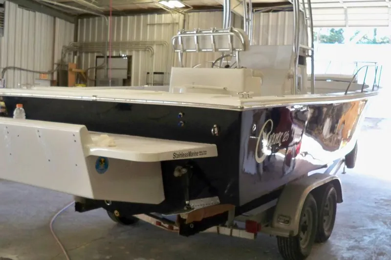 Slide: The Image of Manufacturer Provided Image: 2026 C-Hawk 26 Center Console boat on trailer in a garage. - 12