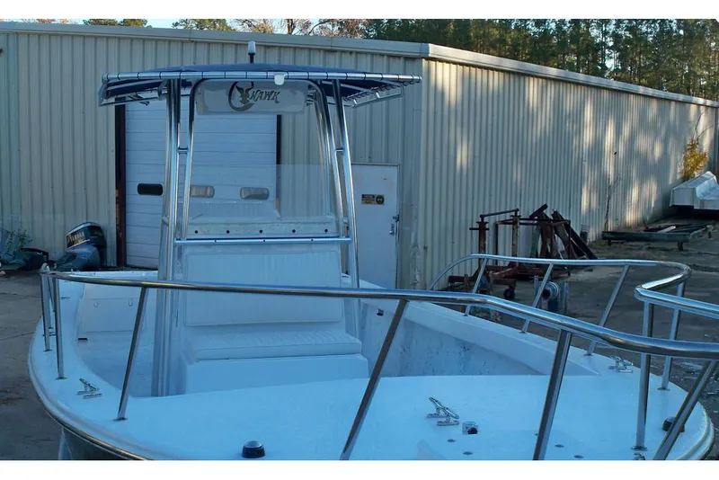 Slide: The Image of Manufacturer Provided Image: 2026 C-Hawk 26 Center Console boat docked near a warehouse. - 13