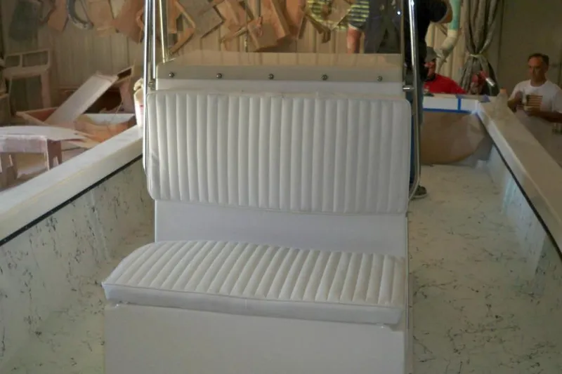 Slide: The Image of Manufacturer Provided Image: 2026 C-Hawk 26 Center Console boat interior with white cushioned seating. - 14