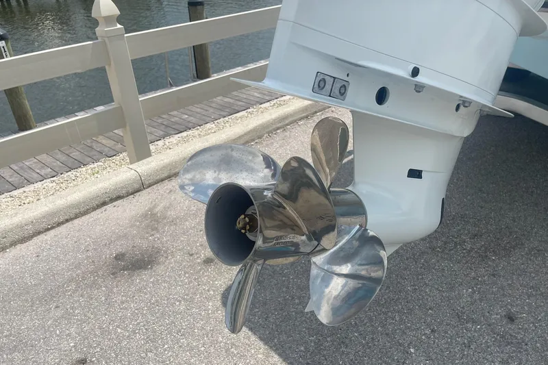 Slide: The Image of 2026 C-Hawk 26 Center Console boat propeller by the water. - 4