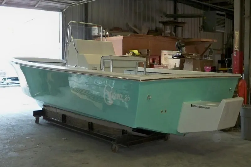 Slide: The Image of Manufacturer Provided Image: 2026 C-Hawk 26 Center Console boat in a workshop setting. - 8