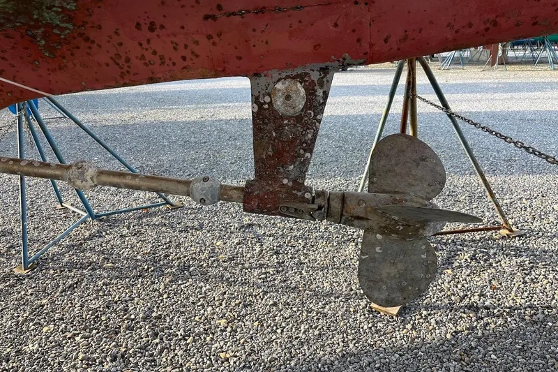 Slide: The Image of Close-up of a 2004 Hylas 49 sailboat propeller and shaft on gravel. - 5
